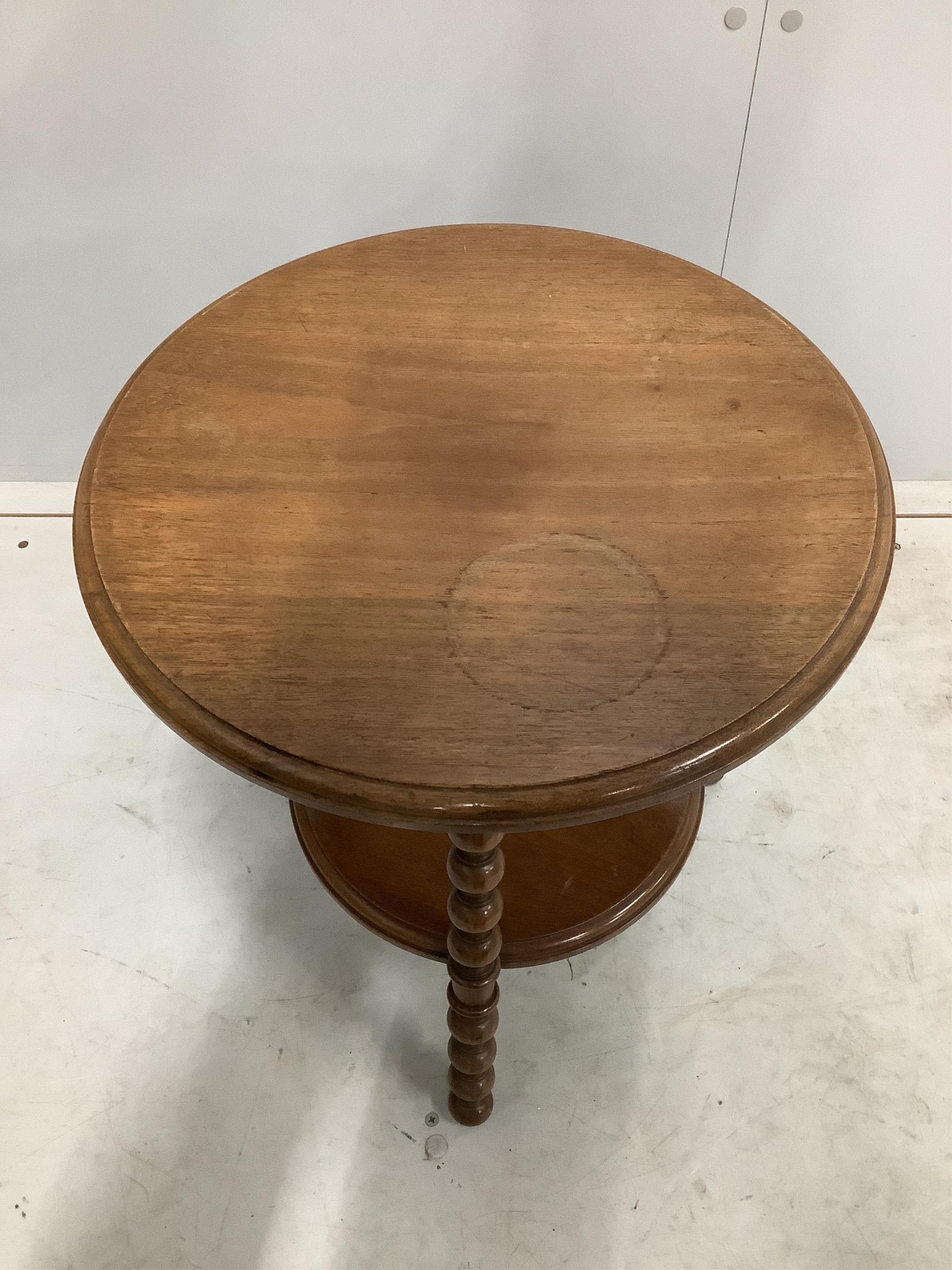 An Edwardian oval mahogany inlaid tea tray, width 55cm, and a late Victorian bobbin turned circular two tier occasional table. Condition - fair